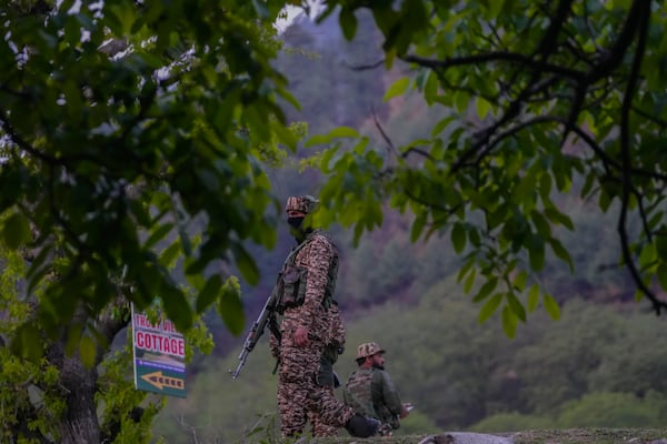 Indian security officers stand guard near Pahalgam in south Kashmir after assailants indiscriminately opened fired at tourists visiting Pahalgam, Indian controlled Kashmir, Tuesday, April 22, 2025.(AP Photo/Dar Yasin)