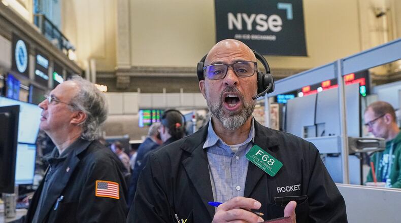 Options trader Steven Rodriguez, center, works on the floor of the New York Stock Exchange, Monday, May 11, 2026. (AP Photo/Richard Drew)