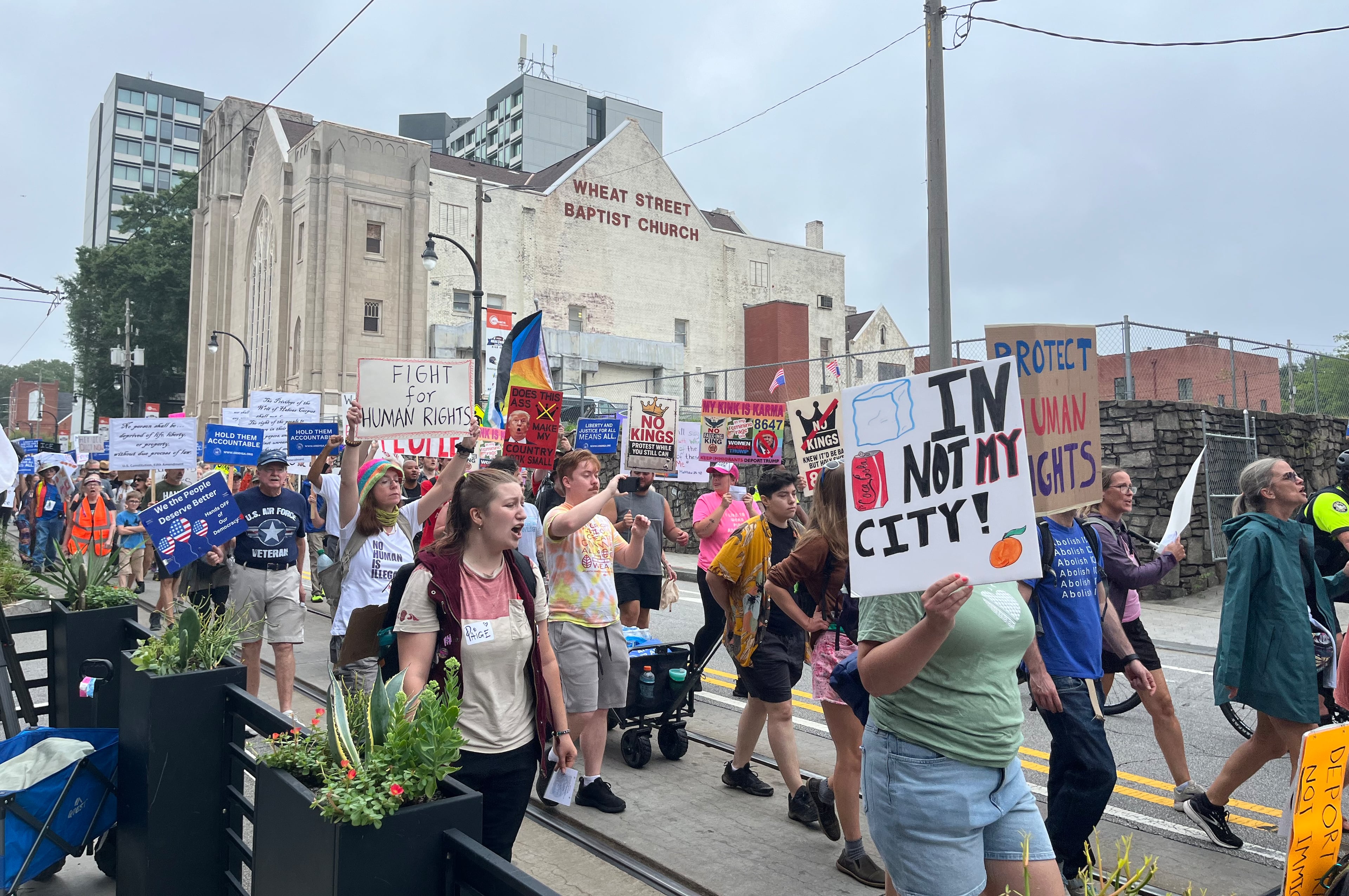 Demonstrators march from The King Center to the Atlanta ICE field office in a "Rage Against the Regime" protest.