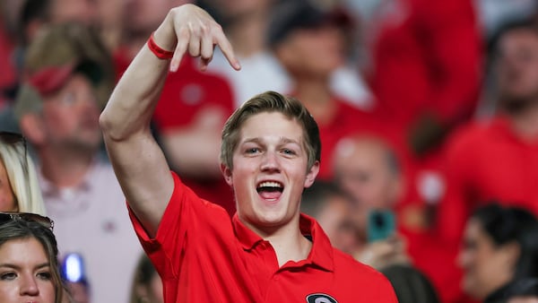 A Georgia football fan flashes the "horns down" symbol during the Bulldogs' October win against Texas.

