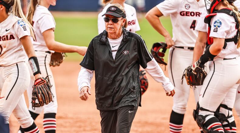 Georgia softball coach Lu Harris-Champer walks away from her team after a pitching mound meeting during the Oklahoma game at the 2021 Women’s College World Series Saturday, June 5, 2021, at USA Softball Hall of Fame Stadium in Oklahoma City, Okla. (Tony Walsh/UGA Athletics)