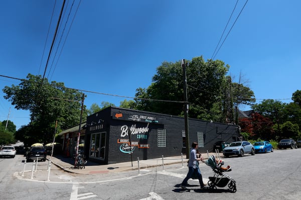 "We made a mistake and acted without enough consideration, and that is not reflective of the kind of people we want to be," Bellwood's owners posted on social media, after painting over a mural that had been on the side of their building for years. (Miguel Martinez/AJC)