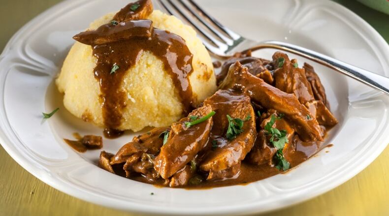 A jarred mole paste makes for a quick sauce with chicken. Serve over quick-cooking instant polenta. (Bill Hogan/Chicago Tribun/TNS)