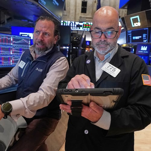 Specialist Michael Pistillo. Left, and trader Fred's Demarco work on the floor of the New York Stock Exchange, Wednesday, May 13, 2026. (AP Photo/Richard Drew)