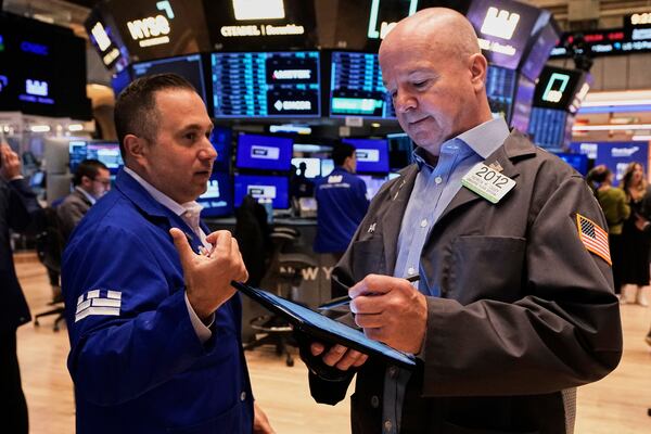 Specialist Gennaro Saporito, left, and trader Patrick Casey work on the floor of the New York Stock Exchange, Thursday, May 29, 2025. (AP Photo/Richard Drew)