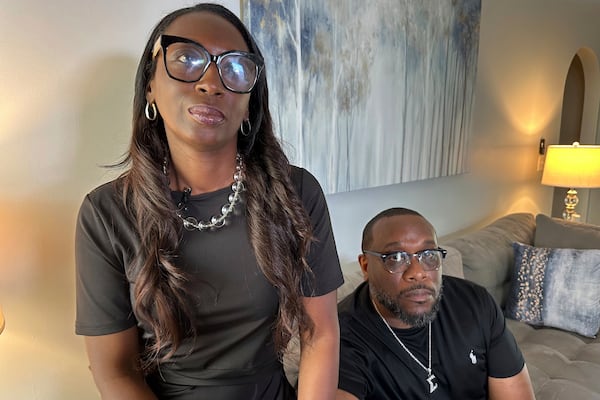 Trina Martin, left, and Toi Cliatt sit for a portrait inside the home the FBI mistakenly raided in 2017, in Atlanta on Friday, April 25, 2025. (AP Photo/Sudhin Thanawala)