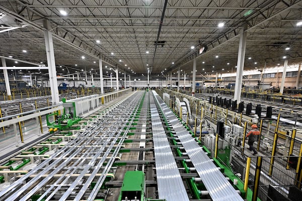 Aluminum products from new electric extruder machinery are on a production line at Hydro’s aluminum extrusion plant, Wednesday, Feb. 25, 2026, in Gainesville. (Hyosub Shin/AJC)