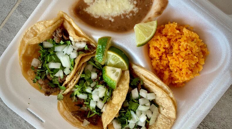 After a recent price increase at J's Snackland in Smyrna, this combo plate of three steak tacos, rice and beans will set you back $7.50. Henri Hollis/henri.hollis@ajc.com