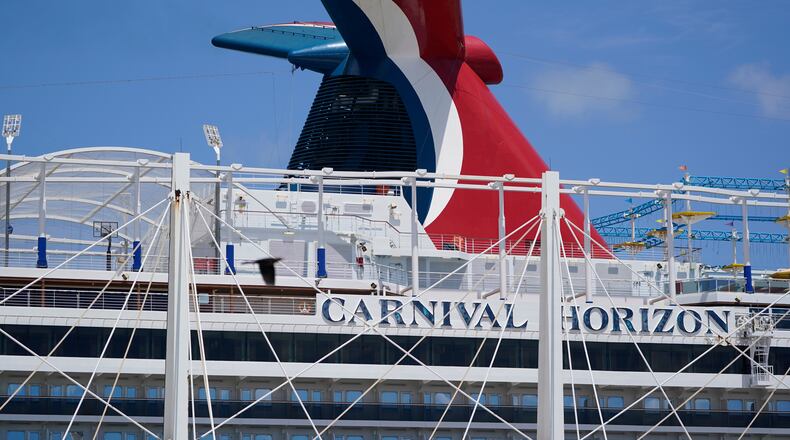 FILE - Carnival Cruise Line's Carnival Horizon cruise ship is shown docked at PortMiami, April 9, 2021, in Miami. (AP Photo/Wilfredo Lee, file)