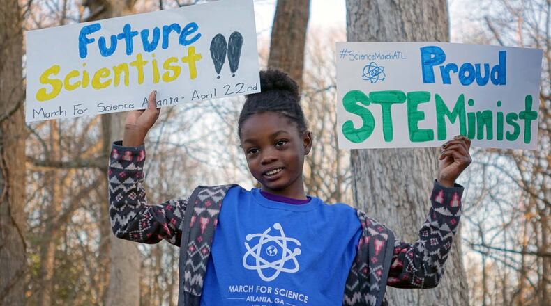 Jayda, the 8-year-old daughter of Atlanta March for Science organizer and Emory microbiologist Jasmine Clark, shows her enthusiasm for science. How do we get more girls to see themselves as scientists? (Photo/Atlanta March for Science)