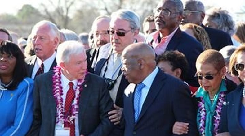 U.S. Sen. Jeff Sessions (R-Alabama) clasps the hand of U.S. Rep. John Lewis (D-Georgia) during a commemoration of the “Bloody Sunday” march for voting rights on the Edmund Pettus Bridge in Selma. (Facebook photo.)