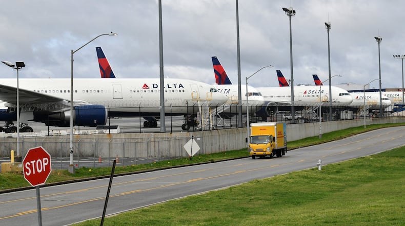 Delta planes parked at Hartsfield-Jackson after the airline cut flights. (Hyosub Shin / Hyosub.Shin@ajc.com)