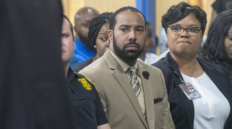 Wynbrooke Elementary School principal Jermain Sumler-Faison (right) and Sean Tartt (center), DeKalb County Region-3 Superintendent, listen to a speaker during an information session at Wynbrooke Elementary School in Stone Mountain, Tuesday, April 30, 2019. The DeKalb County Schools Police Department has a warrant out for a juvenile suspect who is accused of firing a pellet gun at students while playing on a playground on the Wynbrooke Elementary School campus last week. (ALYSSA POINTER/ALYSSA.POINTER@AJC.COM)