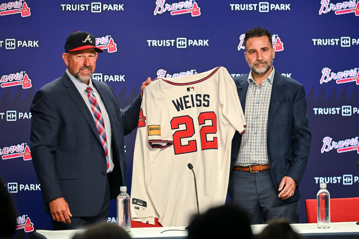 Newly hired Braves manager Walt Weiss (left) and president of baseball operations Alex Anthopoulos hold Weiss’ jersey during a news conference Tuesday, Nov. 4, 2025, at Truist Park in Atlanta. (Daniel Varnado for the AJC)