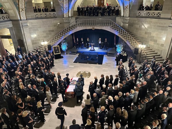 The casket of former Missouri Gov. and U.S. Sen. Christopher "Kit" Bond is brought into the Rotunda of the Missouri Capitol for a memorial service on Tuesday, May 20, 2025, in Jefferson City, Missouri. (AP Photo/David A. Lieb)