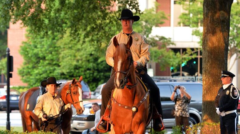 Governor Brian Kemp is scheduled to speak during the 7:30 p.m. May 9 vigil for fallen law enforcement officials in Glover Park on the Marietta Square. Police Week is being observed nationally this week. AJC file photo