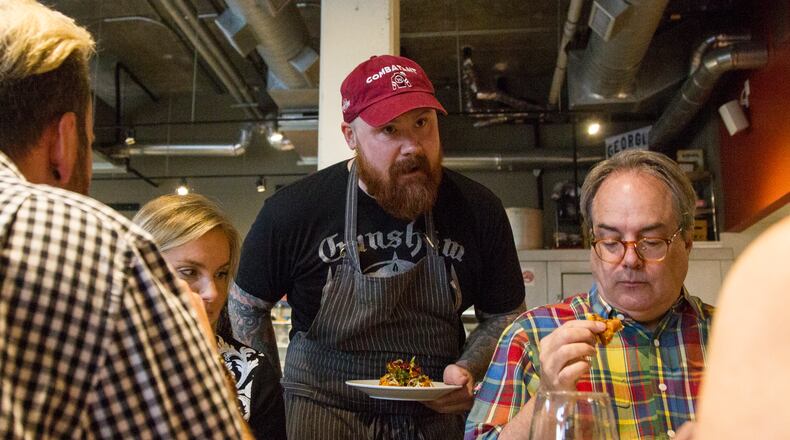 Kevin Gillespie serves a dish for the dinner crowd May 8, 2018 at Gunshow in Atlanta. Gillespie was recently diagnosed with renal cancer and will have to undergo treatment. (REANN HUBER/REANN.HUBER@AJC.COM)