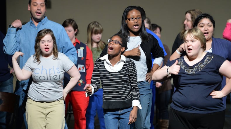 Katharine Burnette (center) performs during a rehearsal for Little Shop of Horror, which is her third production with the Jerry’s Habima Theatre company, at Marcus Jewish Community Center of Atlanta. The Habima Theatre is Georgia’s only theatrical company that features actors with special needs along with professional actors from the community. Katharine Burnette was born premature, blind in one eye, and with cerebral palsy. Doctors said she would never walk. They were only partly right. Now 22, Katherine is not only walking, she has made a name for herself, holding audiences spellbound with her voice. HYOSUB SHIN / HSHIN@AJC.COM