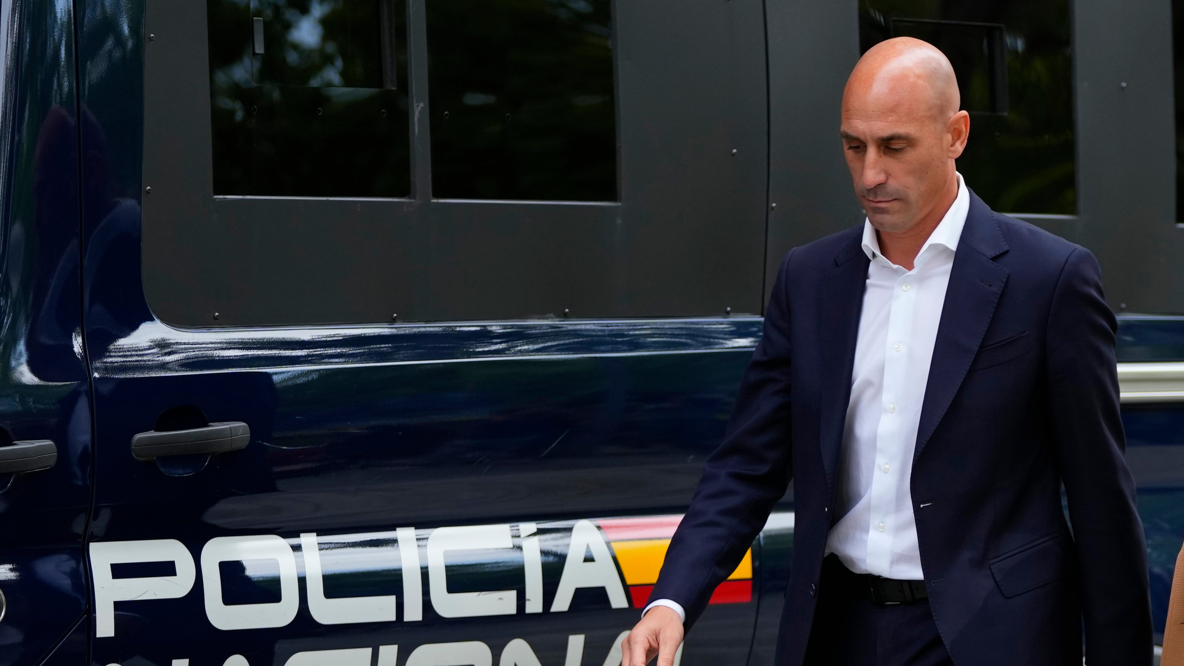 FILE - The former president of Spain's soccer federation Luis Rubiales passes a police van as he leaves after testifying at the National Court in Madrid, Spain,Sept. 15, 2023. (AP Photo/Manu Fernandez, File)