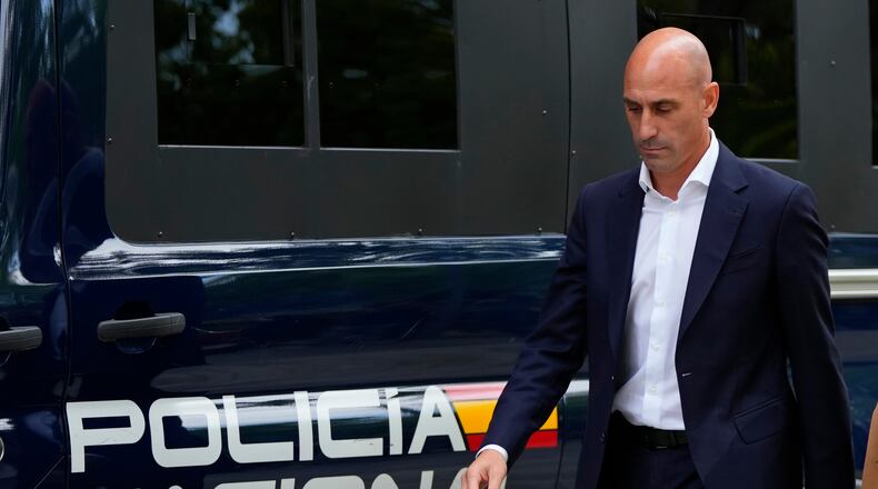 FILE - The former president of Spain's soccer federation Luis Rubiales passes a police van as he leaves after testifying at the National Court in Madrid, Spain,Sept. 15, 2023. (AP Photo/Manu Fernandez, File)