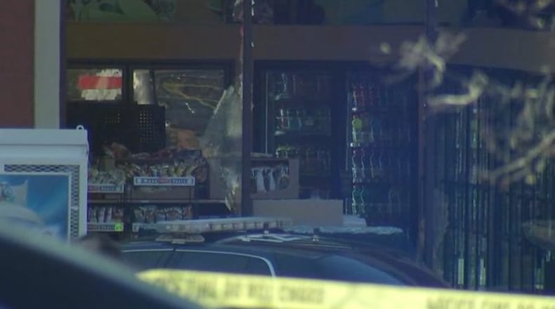 A standoff ended with a robbery suspect dead and another in custody in DeKalb County, police said.