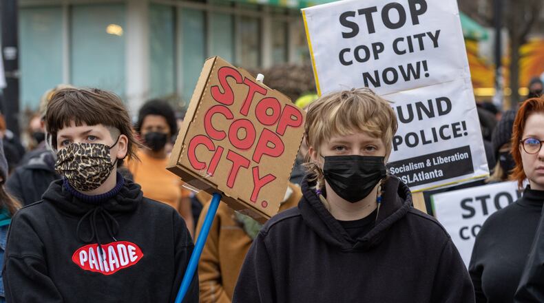 Forest Defender protesters gathered for a rally near Underground Atlanta Saturday, Jan. 21, 2023. Atlanta Police Department said several people were arrested after a Police car was set afire. (Steve Schaefer/steve.schaefer@ajc.com)