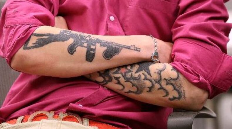 Hunter Chandler, 17, listens to fellow juvenile offenders deliver presentations during a Second Chance program meeting at the Clayton County Juvenile Justice Center in Jonesboro. Curtis Compton/ccompton@ajc.com