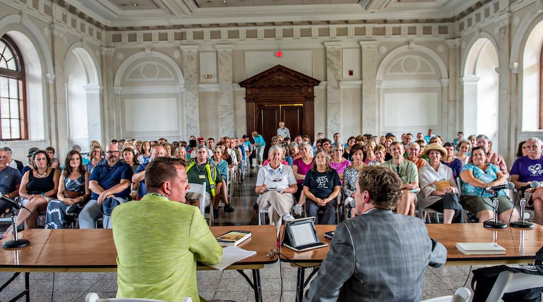 Author Jamie Brickhouse (left) is introduced to the crowd by John Lemley during the AJC Decatur Book Festival on Saturday, September 5, 2015. The DBF the largest independent book festival in the country and one of the five largest overall. Since its launch, more than 1,000 world-class authors and hundreds of thousands of festival-goers have crowded the historic downtown Decatur square to enjoy book signings, author readings, panel discussions, an interactive children's area, live music, parades, cooking demonstrations, poetry slams, writing workshops, and more. JONATHAN PHILLIPS / SPECIAL