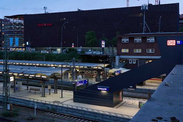 Investigators work at Hamburg, Germany's Central Station on Friday, May 23, 2025, after several people were injured in a knife attack. (Georg Wendt/dpa via AP)