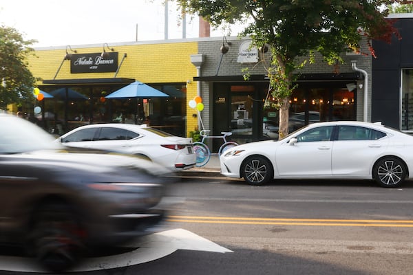 Cars drive by the newly reopened Cascade Road in Atlanta on Wednesday, Aug. 27, 2025. (Abbey Cutrer/AJC)