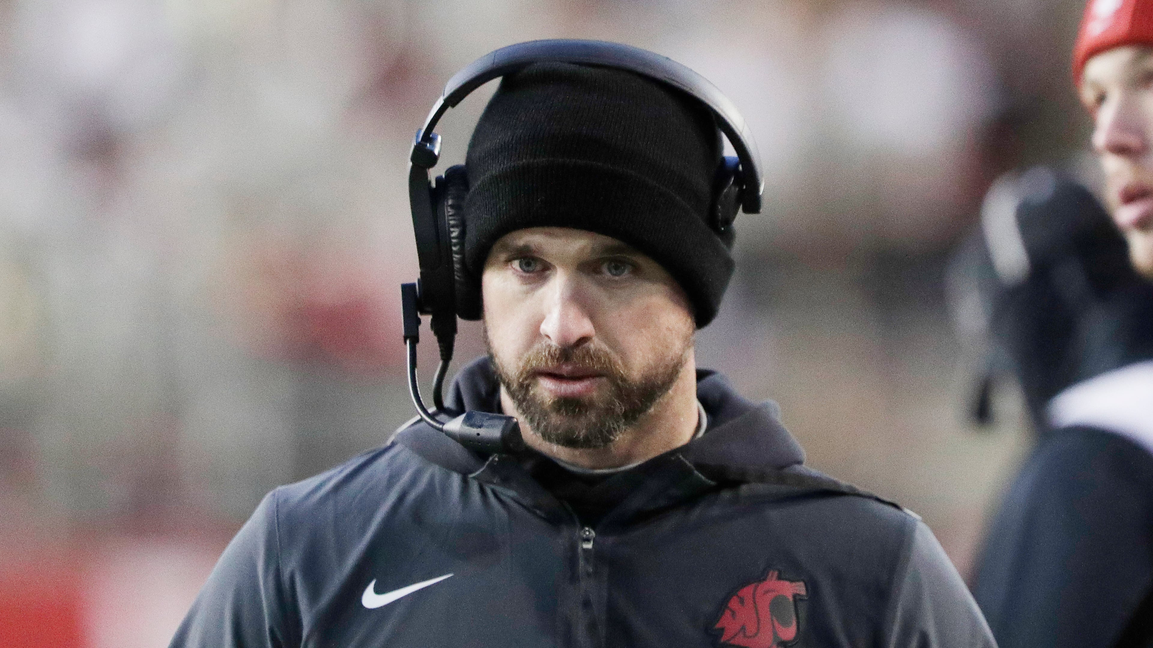 Washington State head coach Jimmy Rogers walks on the sideline during the first half of an NCAA college football game against Oregon State, Saturday, Nov. 29, 2025, in Pullman, Wash. (AP Photo/Young Kwak)