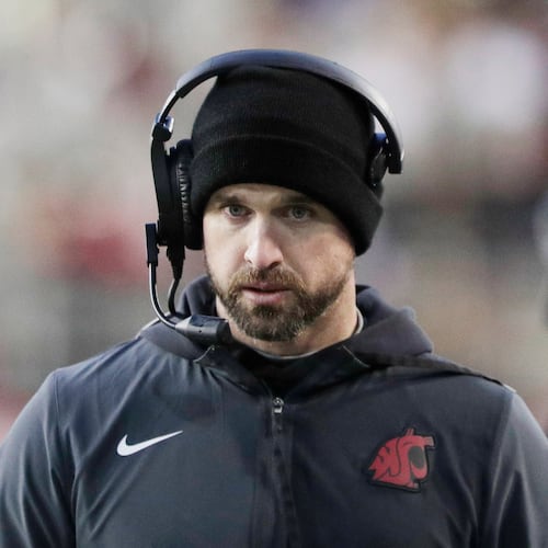 Washington State head coach Jimmy Rogers walks on the sideline during the first half of an NCAA college football game against Oregon State, Saturday, Nov. 29, 2025, in Pullman, Wash. (AP Photo/Young Kwak)
