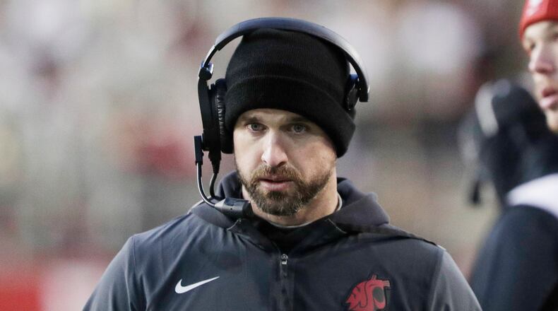 Washington State head coach Jimmy Rogers walks on the sideline during the first half of an NCAA college football game against Oregon State, Saturday, Nov. 29, 2025, in Pullman, Wash. (AP Photo/Young Kwak)
