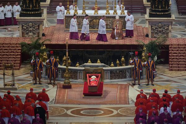 The body of Pope Francis lies inside St. Peter's Basilica at the Vatican, Wednesday, April 23, 2025, where he will lie in state for three days. (AP Photo/Andrew Medichini, Pool)