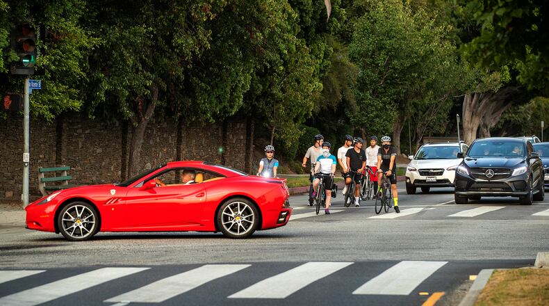 Bicyclists and motorists on San Vicente Boulevard in Brentwood. (Mel Melcon/Los Angeles Times/TNS)