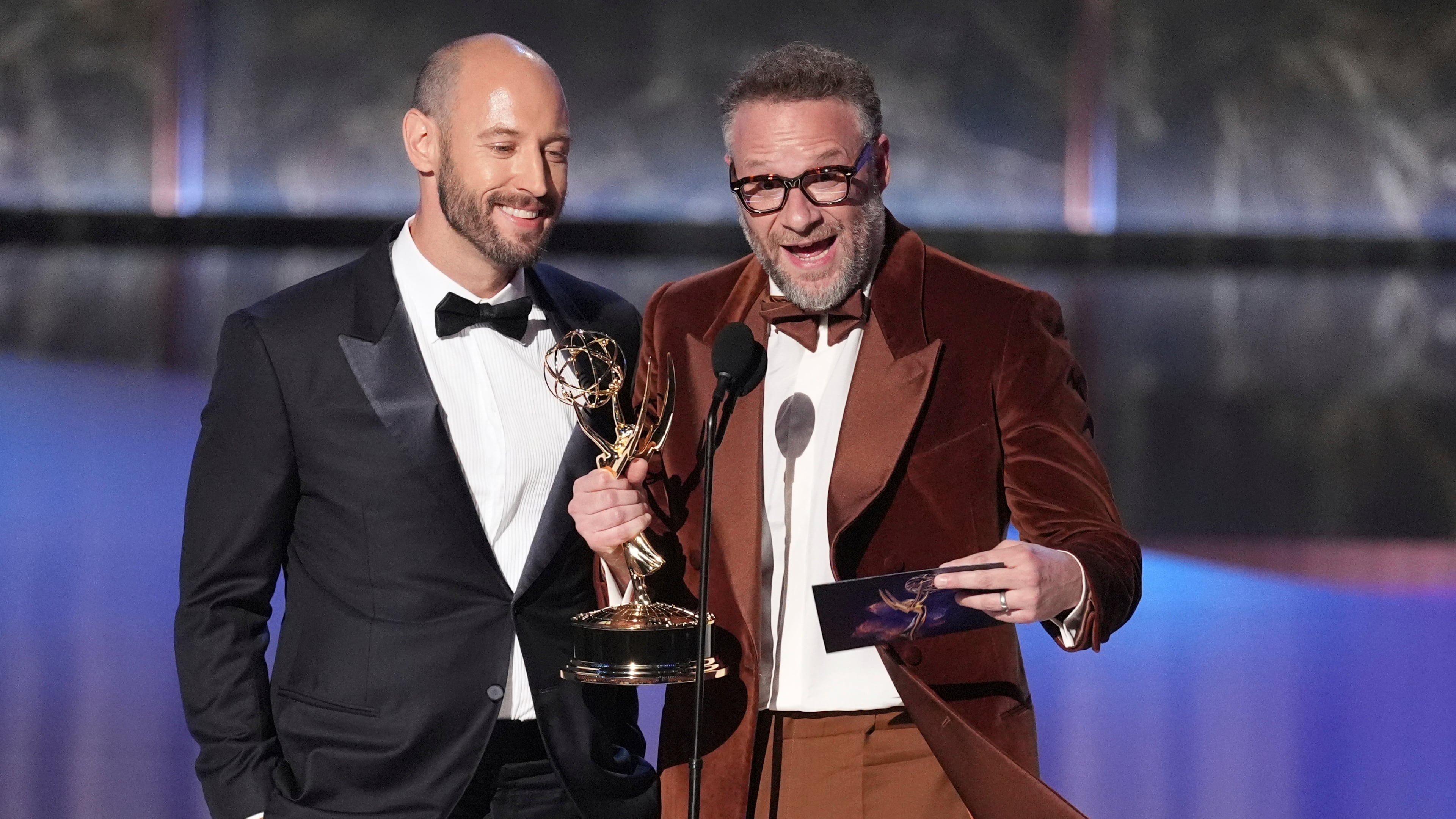 Evan Goldberg, left, and Seth Rogen accept the award for outstanding directing for a comedy series for "The Studio" during the 77th Primetime Emmy Awards on Sunday, Sept. 14, 2025, at the Peacock Theater in Los Angeles. (AP Photo/Chris Pizzello)
