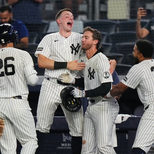 New York Yankees' Ryan McMahon, center, celebrates with Heliot Ramos, right, Ben Rice, second from left, and Luis García Jr. after a baseball game against the Atlanta Braves Saturday, Aug. 8, 2026, in New York. (AP Photo/Frank Franklin II)