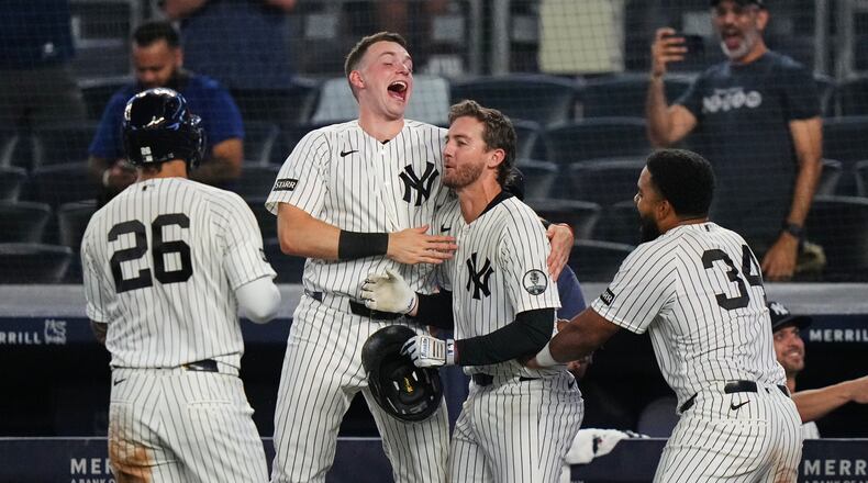 New York Yankees' Ryan McMahon, center, celebrates with Heliot Ramos, right, Ben Rice, second from left, and Luis García Jr. after a baseball game against the Atlanta Braves Saturday, Aug. 8, 2026, in New York. (AP Photo/Frank Franklin II)