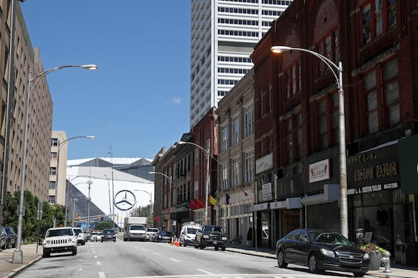 The Mercedes-Benz stadium is shown in the distance along Mitchell street Monday, June 26, 2016, in Atlanta, Ga. PHOTO / JASON GETZ