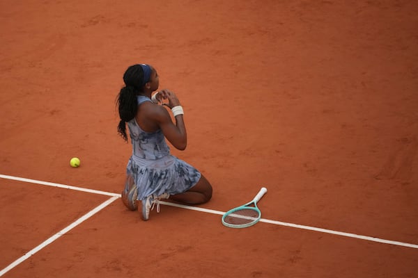 Coco Gauff of the U.S. celebrates as she won the final match of the French Tennis Open against Aryna Sabalenka of Belarus at the Roland-Garros stadium in Paris, Saturday, June 7, 2025. (AP Photo/Christophe Ena)