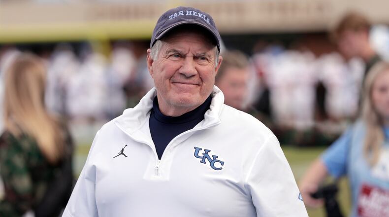 North Carolina head coach Bill Belichick smiles as he walks the sidelines before an NCAA college football game against Stanford, Saturday, Nov. 8, 2025, in Chapel Hill, N.C. (AP Photo/Chris Seward)