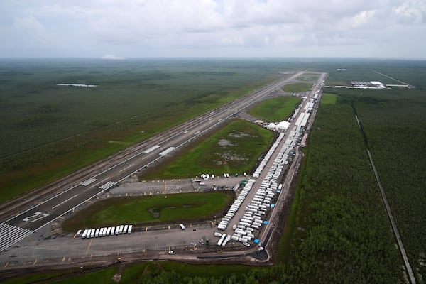 Work progresses on a new migrant detention facility dubbed "Alligator Alcatraz," at Dade-Collier Training and Transition facility in the Florida Everglades, Friday, July 4, 2025, in Ochopee, Fla. (AP Photo/Rebecca Blackwell)