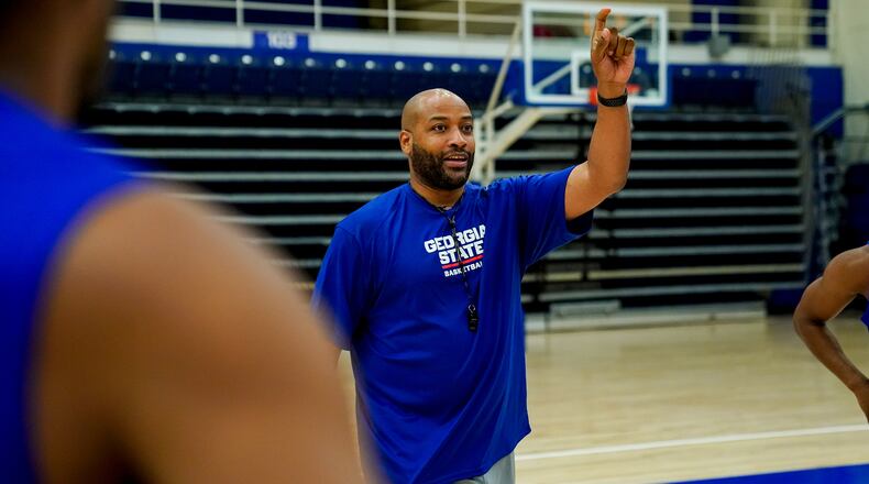 First-year Georgia State coach Jonas Hayes works with his players during summer workouts.