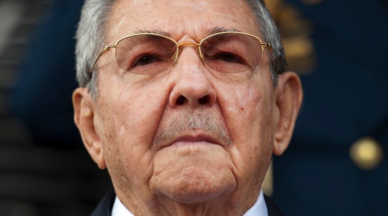 FILE - Cuba's President Raul Castro listens to the Cuban and Venezuelan national anthems during his welcome ceremony at the Miraflores presidential palace in Caracas, Venezuela, March 17, 2015. (AP Photo/Ariana Cubillos, File)
