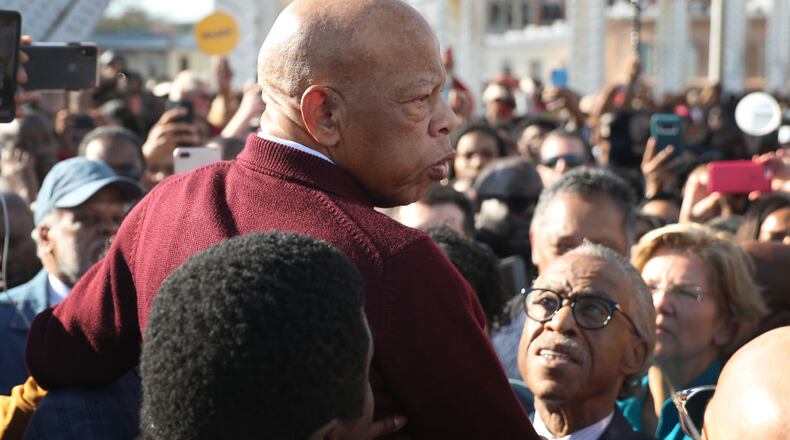 SELMA, ALABAMA - MARCH 01:  Rep. John Lewis (D-GA) is held aloft by Rev. Al Sharpton and others as he speaks to the crowd at the Edmund Pettus Bridge crossing reenactment marking the 55th anniversary of Selma's Bloody Sunday on March 1, 2020 in Selma, Alabama. Mr. Lewis marched for civil rights across the bridge 55 years ago. Some of the 2020 Democratic presidential candidates attended the Selma bridge crossing jubilee ahead of Super Tuesday. (Photo by Joe Raedle/Getty Images)