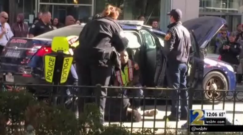 An APD officer was trapped in a car in a crash at Forsyth and Marietta streets. (Credit: Channel 2 Action News)