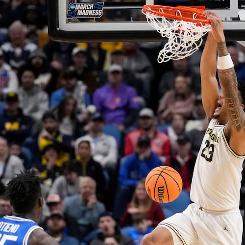 Michigan forward Yaxel Lendeborg (23) dunks against Saint Louis during the first half in the second round of the NCAA college basketball tournament, Saturday, March 21, 2026, in Buffalo, N.Y. (AP Photo/Yuki Iwamura)