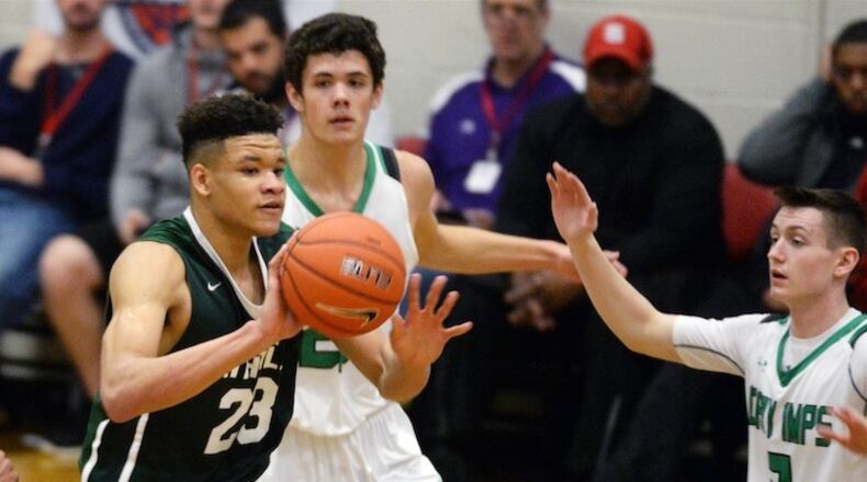 Kevin Knox (23) of Tampa Catholic is surrounded by defenders during the John Wall Holiday Invitational Tournament at Broughton High School in Raleigh, N.C., in December 2016. (Chuck Liddy/Raleigh News & Observer/TNS)