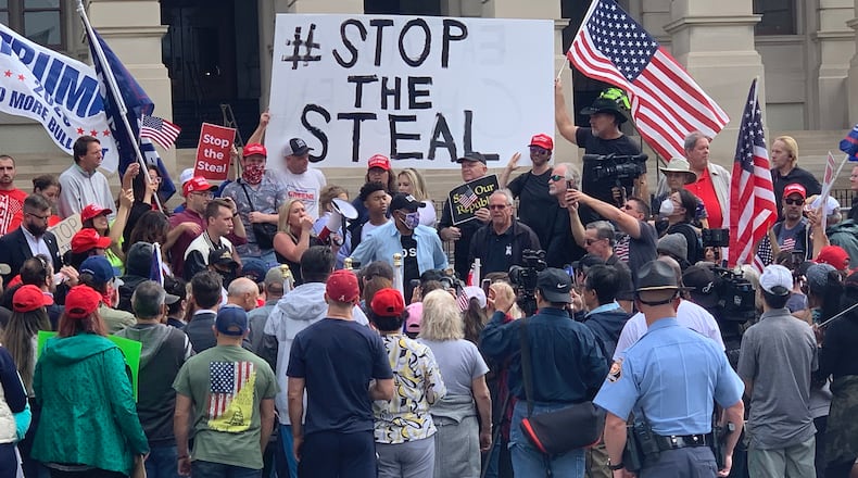 Chants of USA, USA have broken out at the state Capitol as around 200 flag waving Donald Trump supporters rallies on the steps of the State Capitol on Saturday, Nov. 7, 2020. (Christian Boone / AJC)