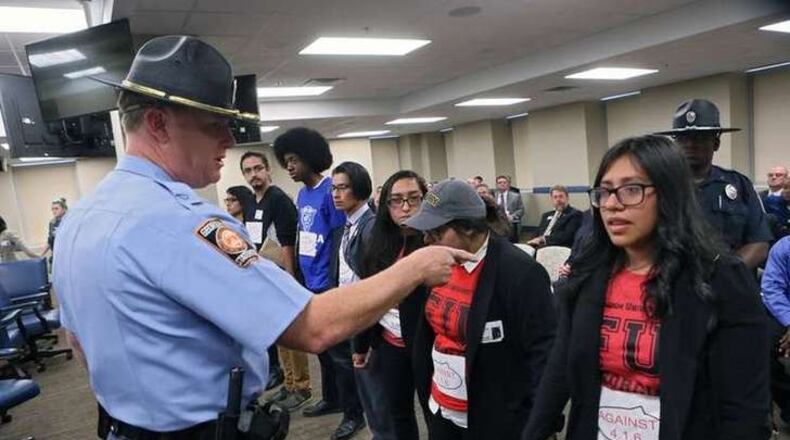 Protesters demonstrated against Georgia Board of Regents policies that bar immigrants without legal status from top schools and qualifying for in-state tuition rates at others. BOB ANDRES /BANDRES@AJC.COM